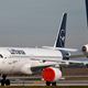 airplanes parked on tarmac